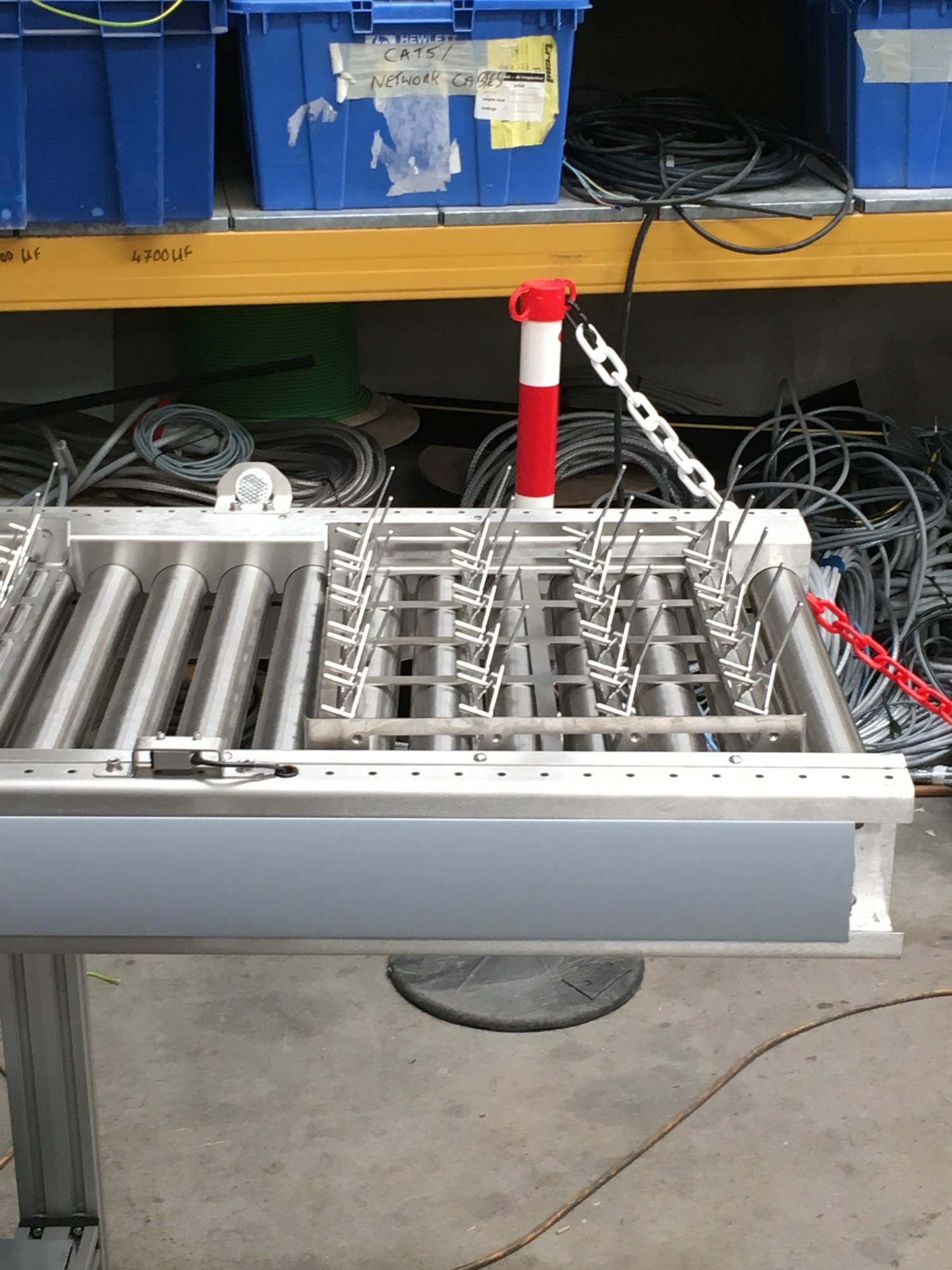 Stainless-steel fixture with parallel rollers and locating fingers